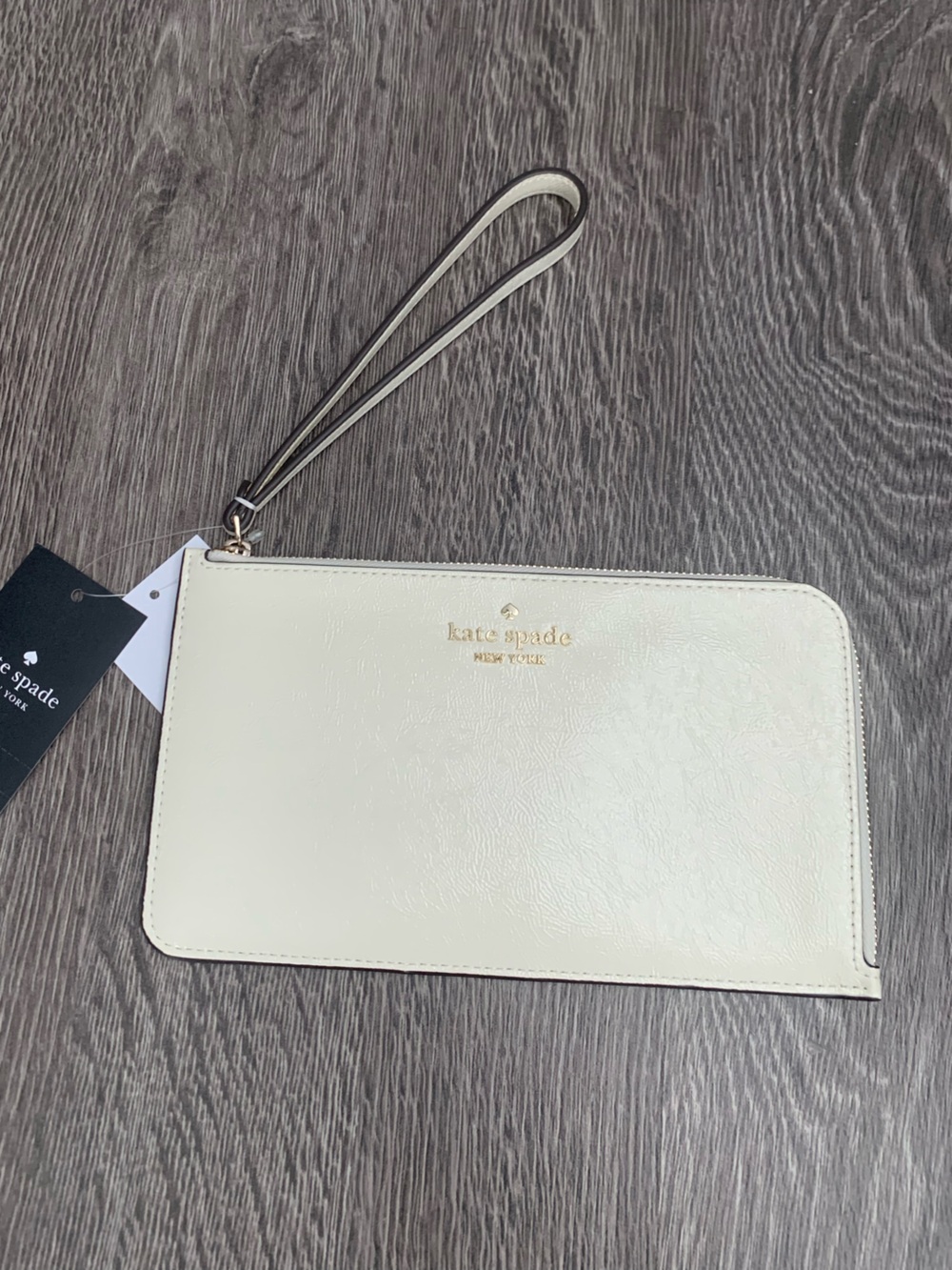 kate spade Lucy Cream Leather Wristlet Clutch with Gold Logo
